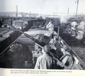 USA Machine Gun Battalions in gondola firing on enemy reconnaissance plane in Naples RR yards (Signal Corps Photo)