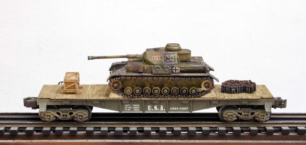 US Army Captured WWII German Pz IV Tank 212 on U.S. Army 40` Flat Car USAX 23007(CAPAV1.1-FC2.2USA/GER)_Operates on 3-Rail “O”Gauge track • Available Today • (CTN 3)