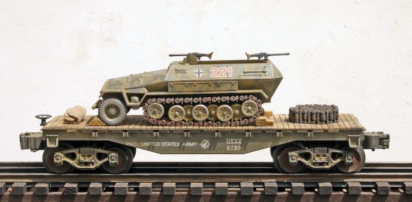 US Army Captured WWII German Sd.Kfz251 Half Track No.221 on U.S. Army  35′ Flat Car(CAPAV4.4-FC1.2USA/GER)_Operates on 3-Rail “O”Gauge track • Available Today • (CTN 20)