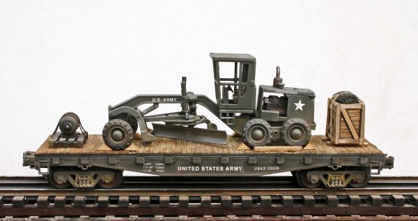 US Army Caterpillar Grader-Leveler with Cab Cover on 42′ Flat Car USAX 23028(EME6B-FC3.2USA)_Operates on 3-Rail “O”Gauge track • Available Today • (CTN 25)