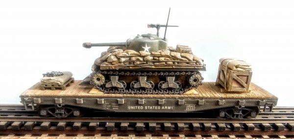 US Army M4A3(76) Sherman Tank w/Cullen Hedgerow Device & Sandbag Soft Armor on 42′ Flat Car USAX 26557(AV3CD-FC3.2USA)_Operates on 3-Rail “O”Gauge track  • Available Today • (CTN 38)